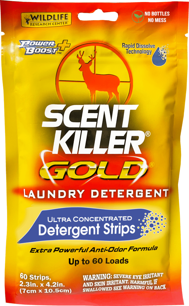 Scent Killer Gold laundry detergent packaging with deer icon on yellow background