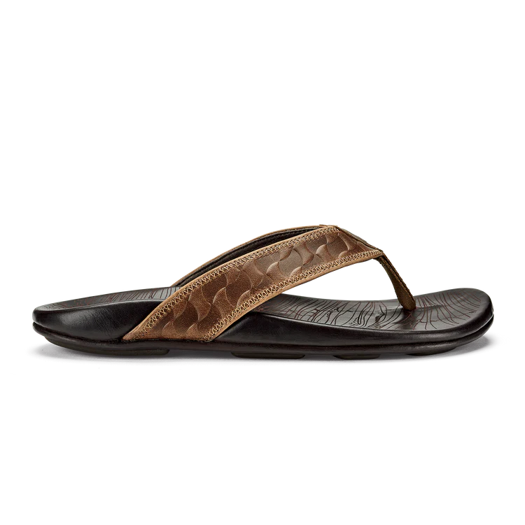 Brown sandal with a textured strap on a white background