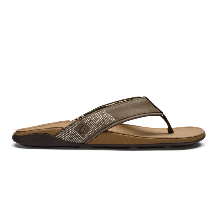 Brown sandal with a textured strap on a white background