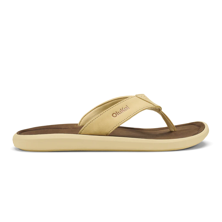 Beige sandal with brown sole on a white background