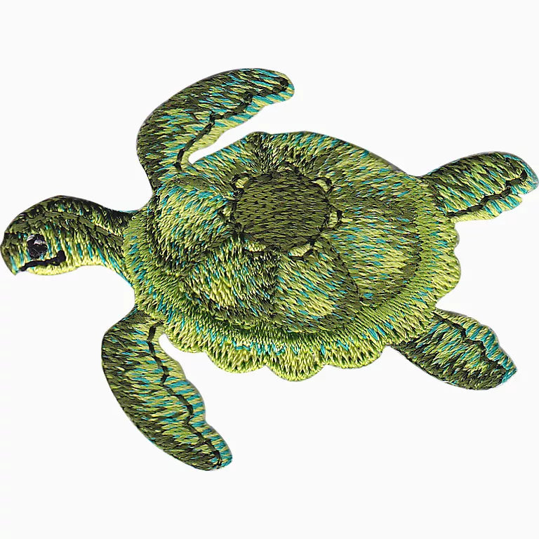 Embroidered green turtle patch on a white background