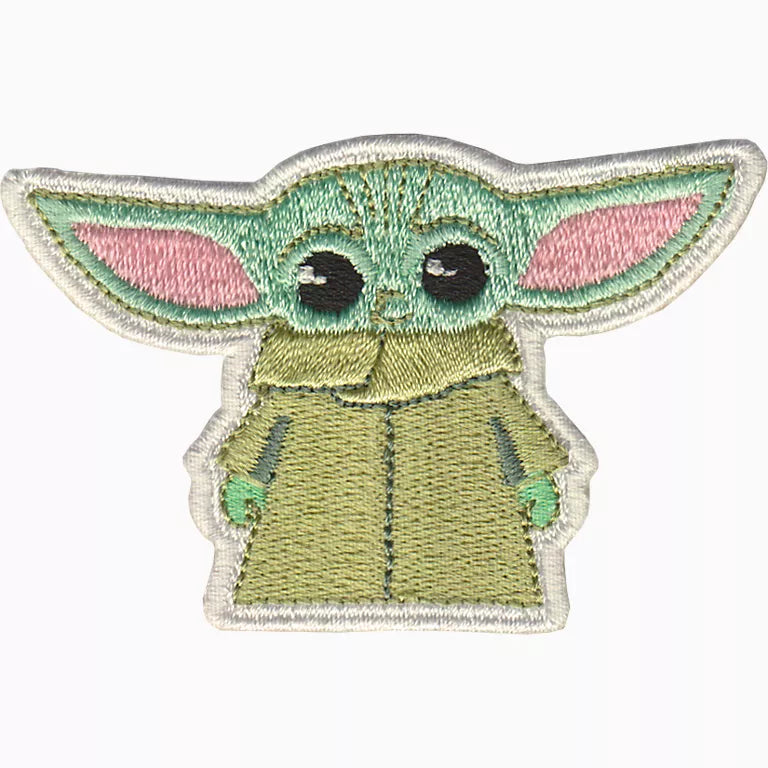 Embroidered patch of a character with large ears and a green outfit on a white background