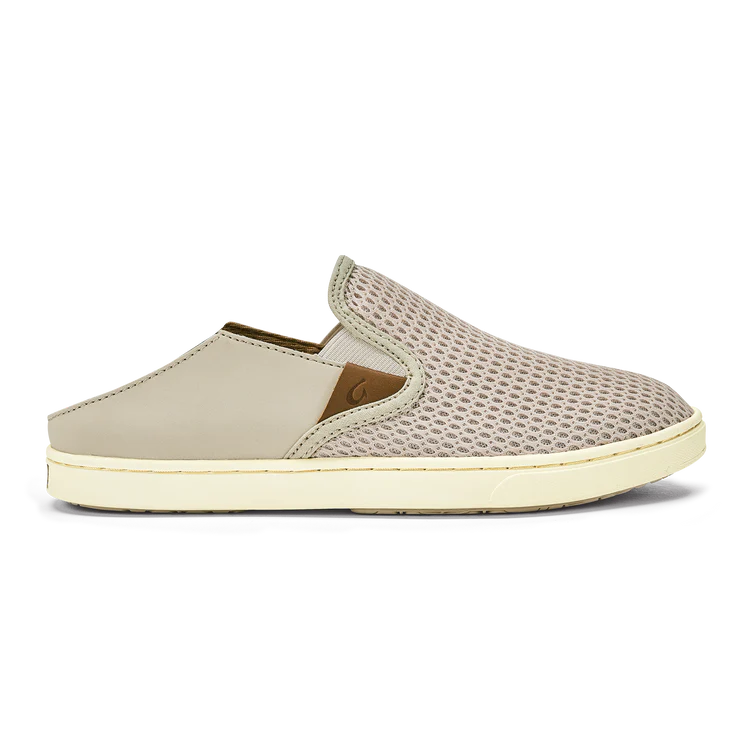 Beige slip-on shoe with textured surface on a white background