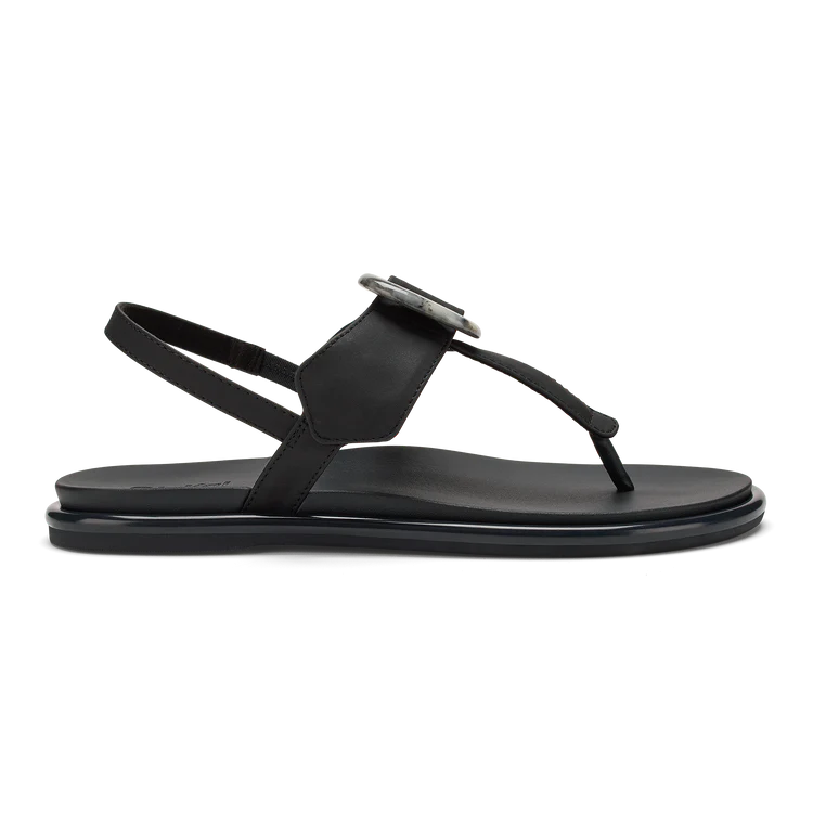 Black sandal with a small decorative element on a white background