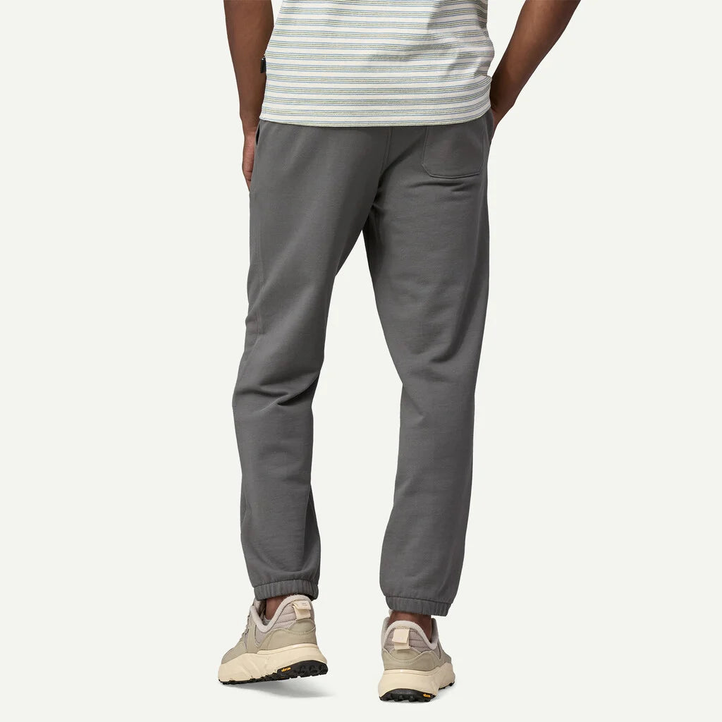 Person wearing gray sweatpants on a white background