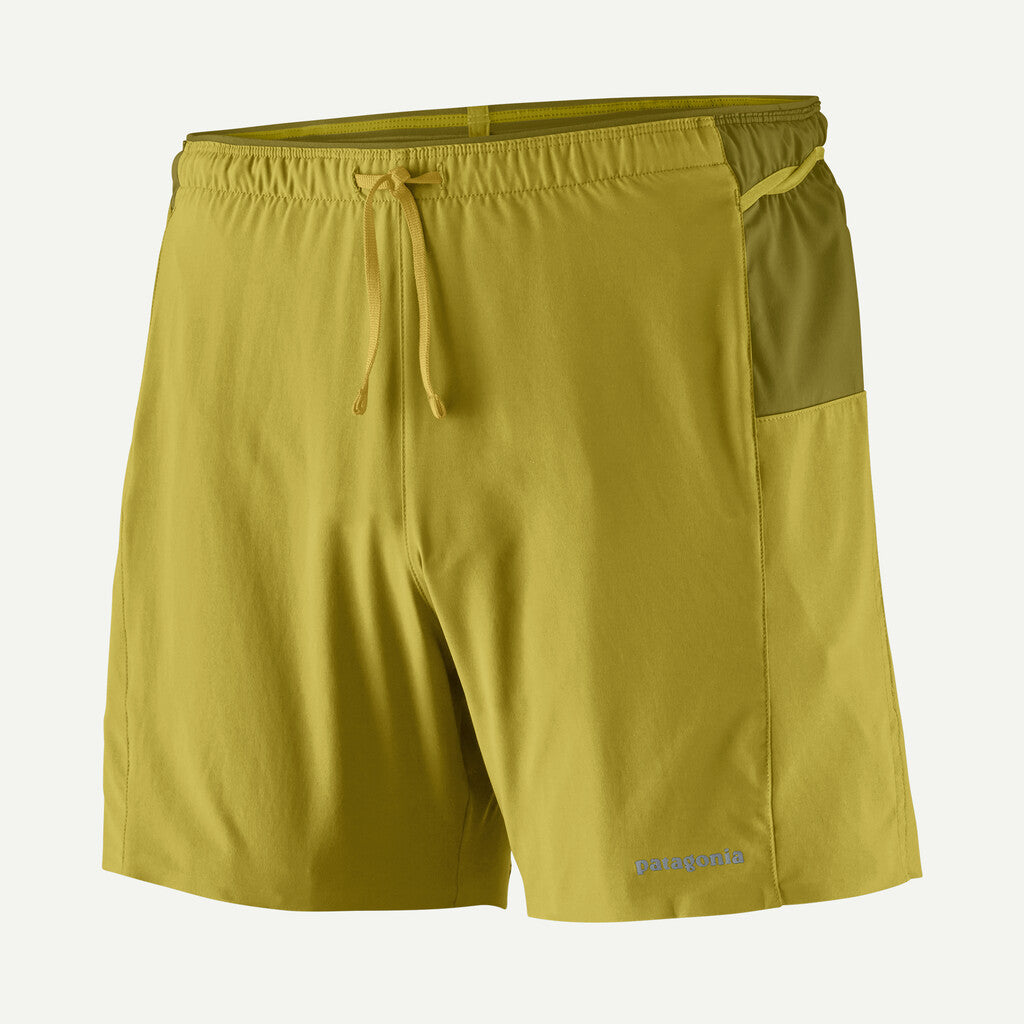 Yellow shorts with a drawstring on a light gray background