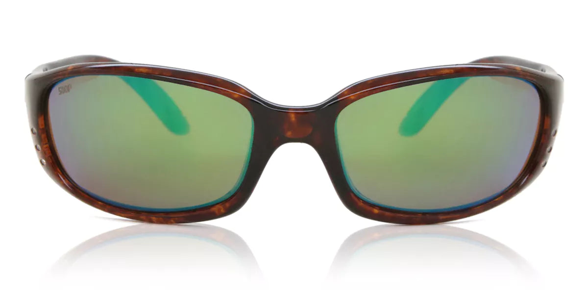 Sunglasses with tortoiseshell frame and green lenses on a white background