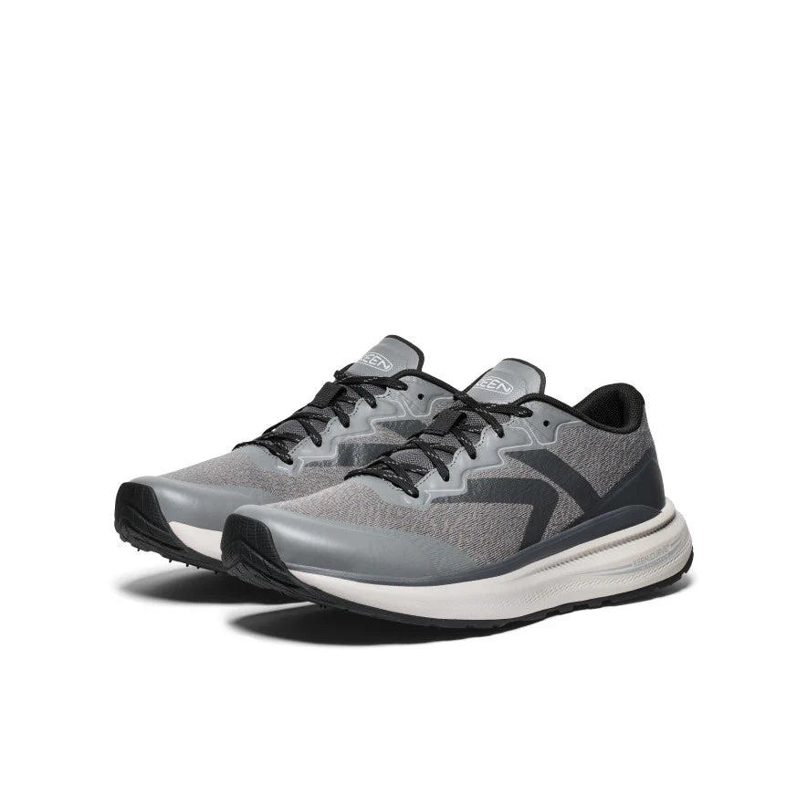 Pair of gray and black athletic shoes on a white background