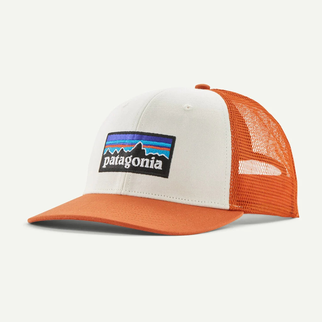 Orange and white cap with Patagonia logo on a light gray background
