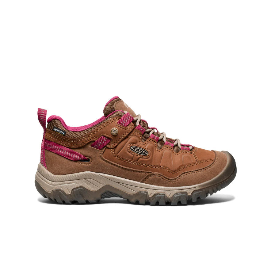 Brown hiking shoe with pink accents on a white background