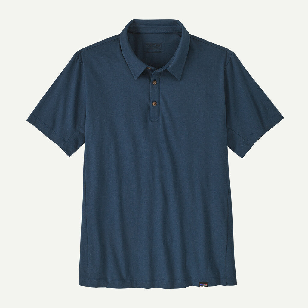 Blue polo shirt on a light gray background