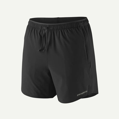Black shorts with a brand logo on a light gray background