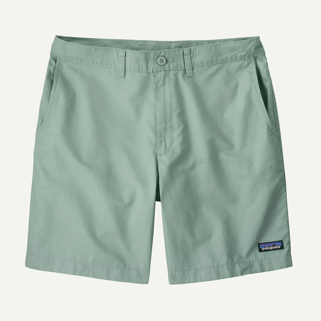 Green shorts with a Patagonia logo on a white background