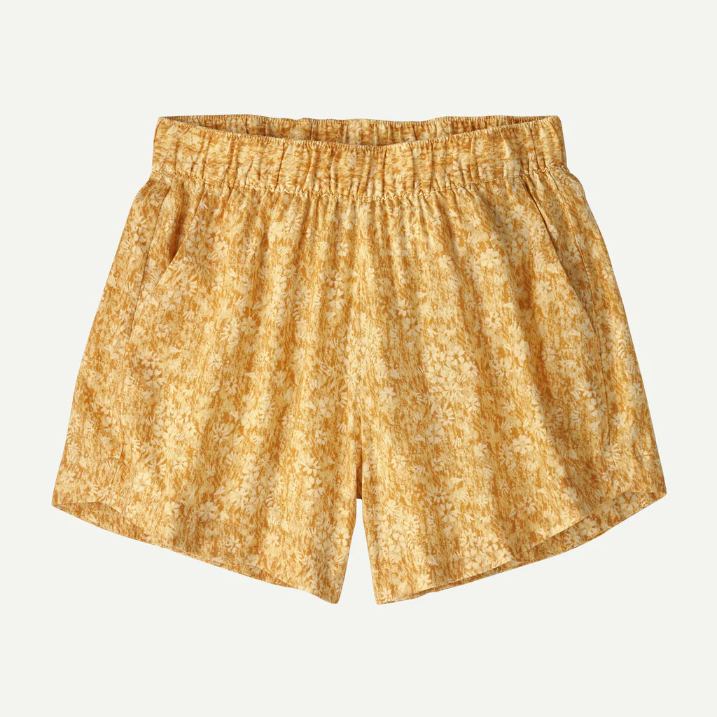 Yellow patterned shorts on a light gray background