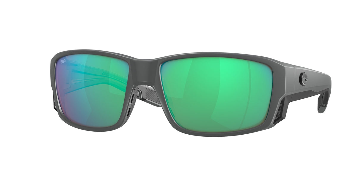 Sunglasses with green reflective lenses on a white background