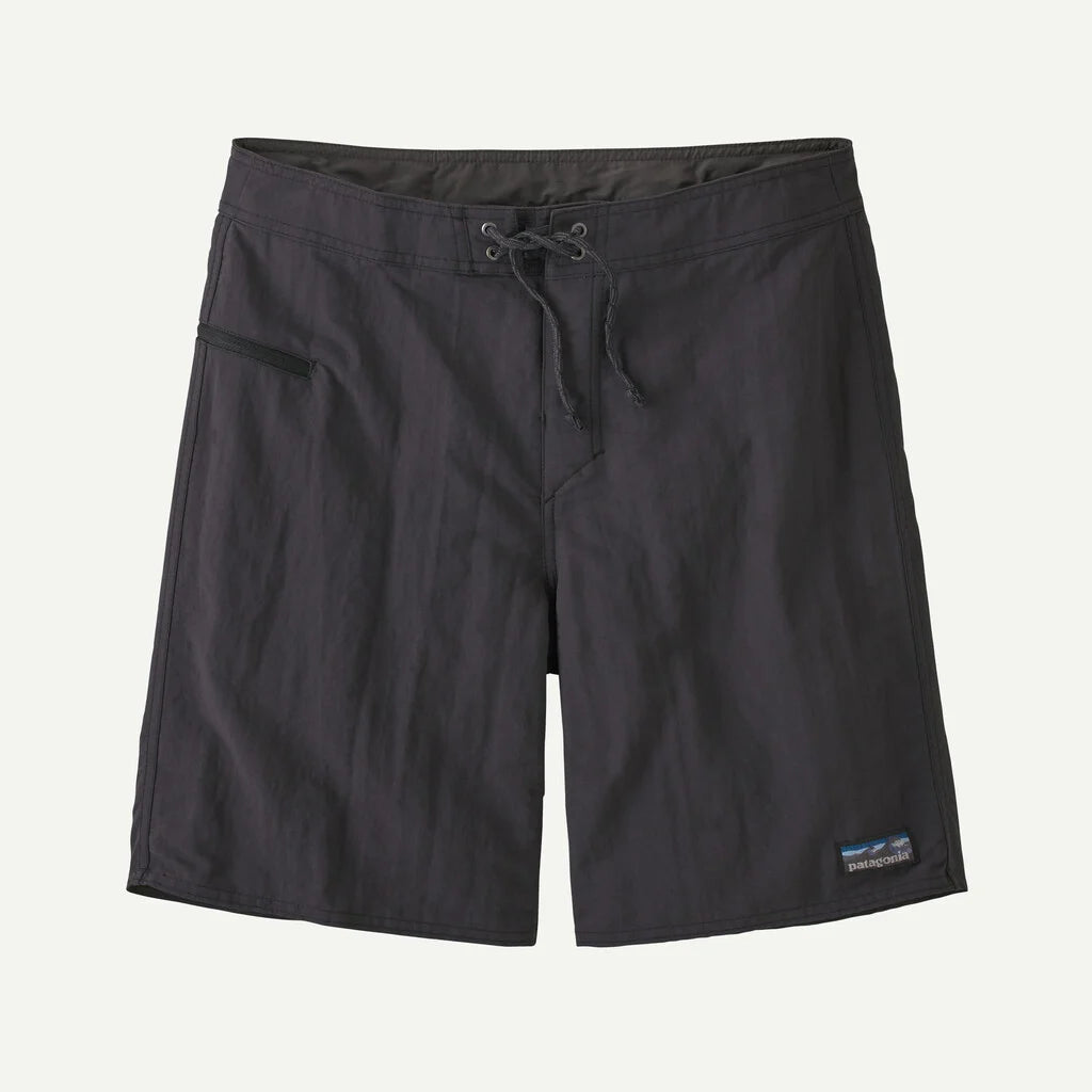 Black shorts with a brand label on a light gray background