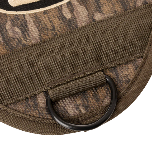 Close-up of a camouflage-patterned bag with a black D-ring on a white background
