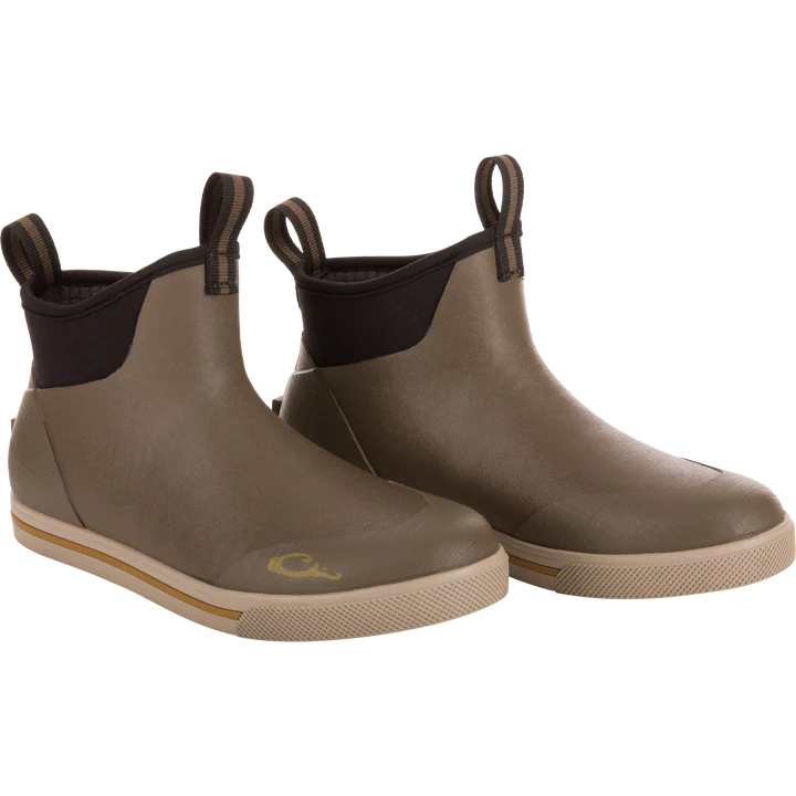 Pair of brown rubber boots with black accents on a white background