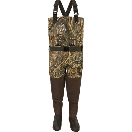 Camouflage hunting waders with suspenders on a white background