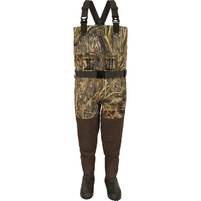 Camouflage hunting waders with suspenders on a white background