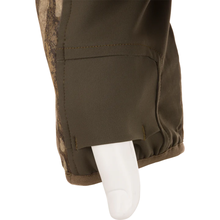 Close-up of brown pants with camouflage pattern on a white background