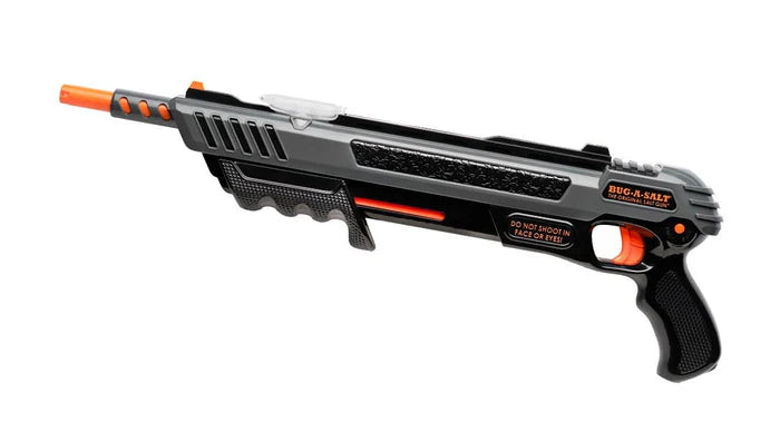 Black and orange toy gun on a white background