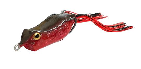 Red and black fishing lure on a white background