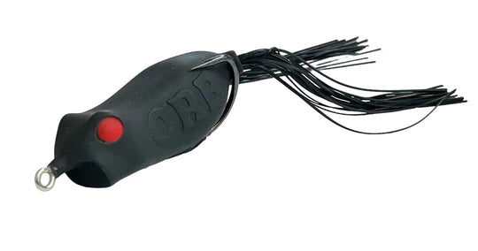 Black fishing lure with red button on a white background