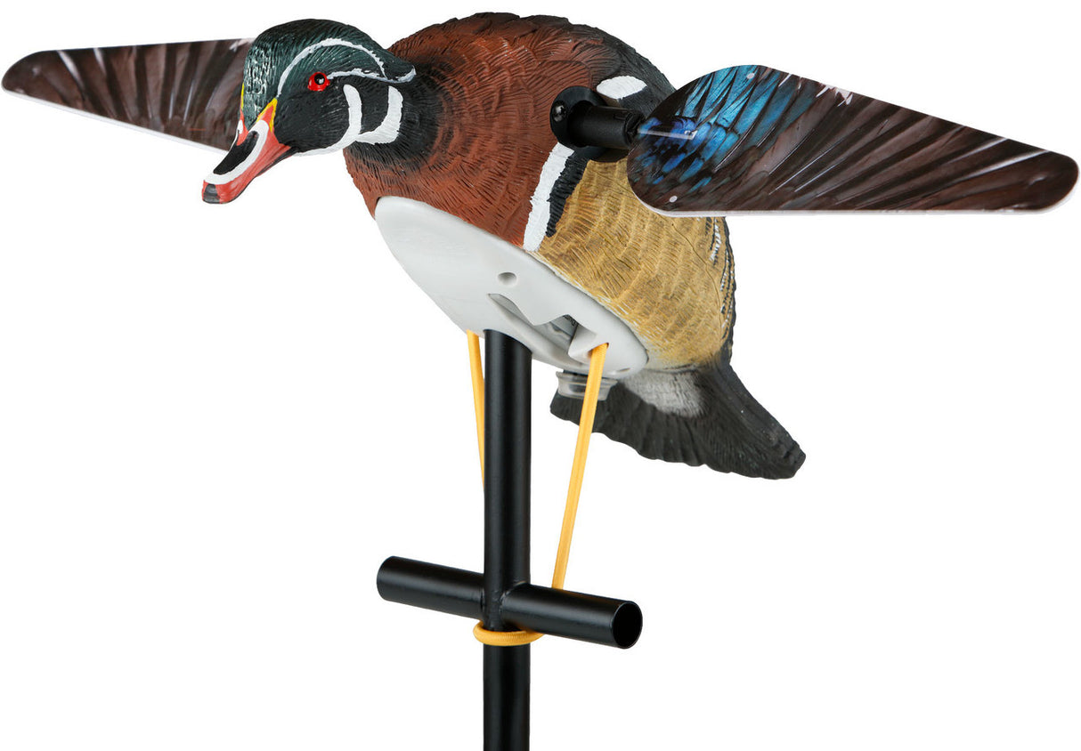 Colorful duck decoy on a stand against a white background