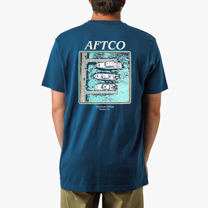 Person wearing a blue t-shirt with 'AFTCO' branding and graphic on the back.