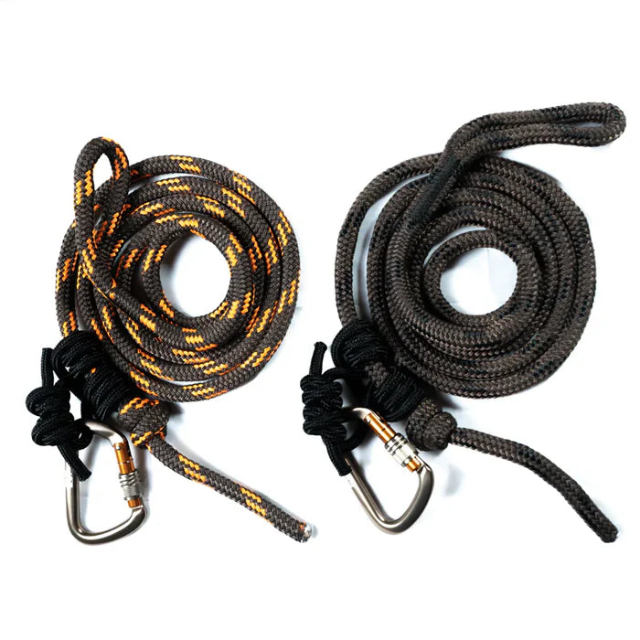 Two coiled ropes with carabiners on a white background