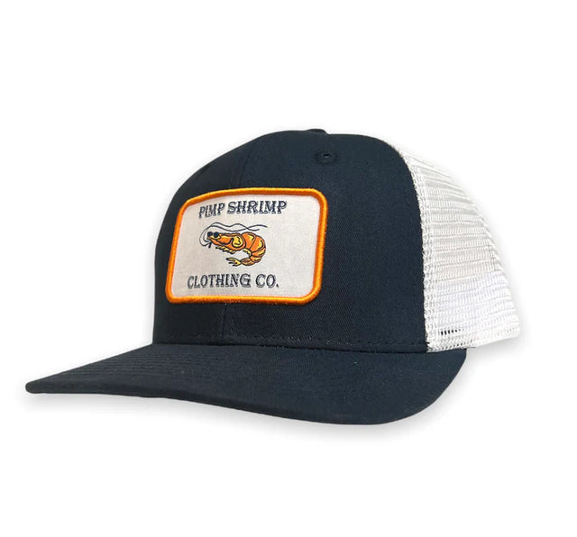 Navy blue and white trucker hat with a patch on a white background