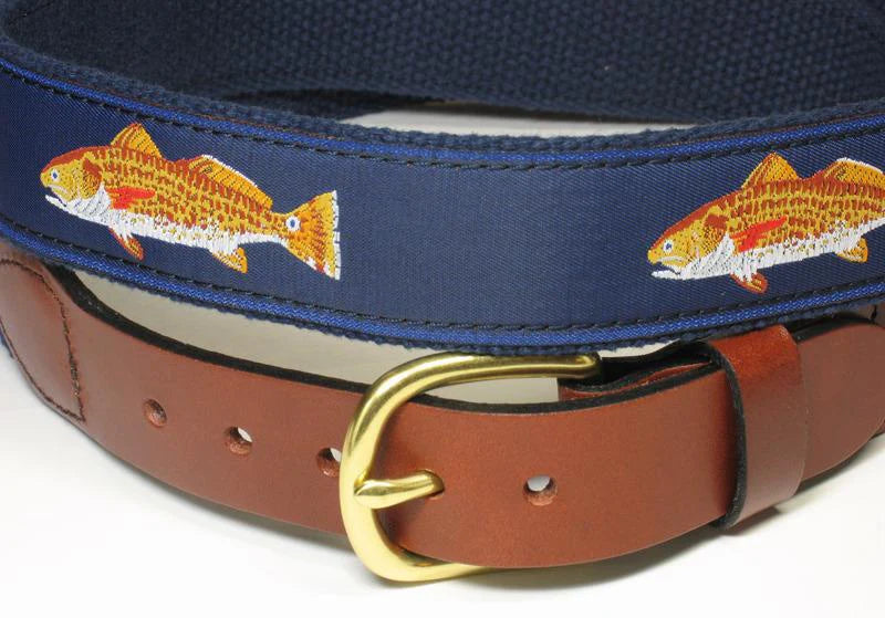 Brown belt with gold buckle on a navy belt with fish embroidery