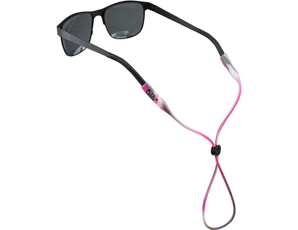 Sunglasses with a pink and black strap on a white background