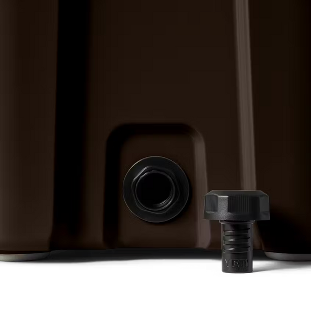 Close-up of a brown container with a black valve and cap on a white background