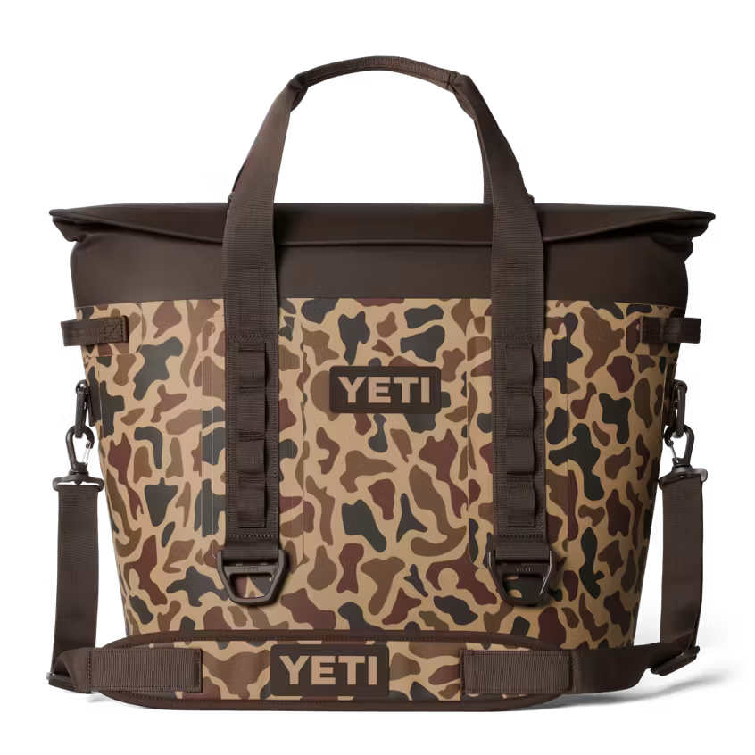 Camouflage YETI cooler bag with brown accents on a white background