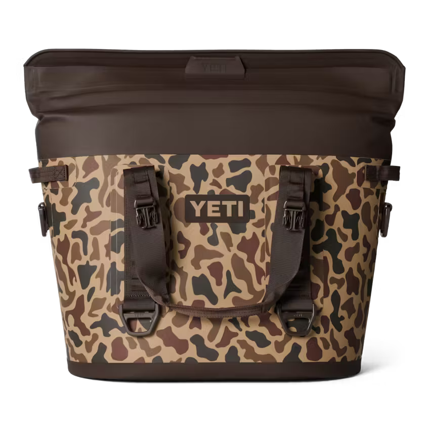 Camouflage-patterned cooler bag with YETI logo on a white background