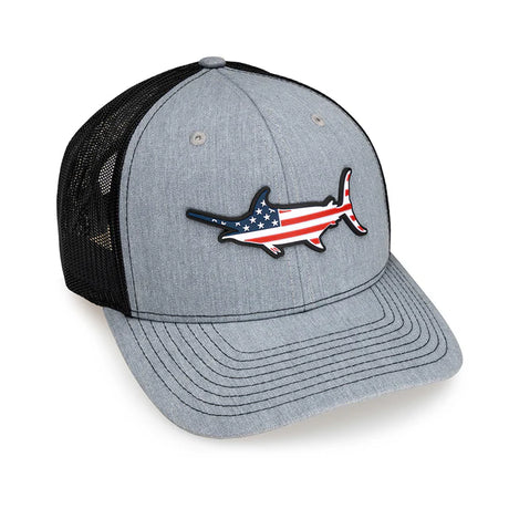 Gray and black trucker hat with American flag shark design on a white background