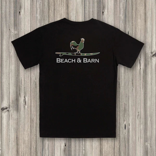 Black t-shirt with 'Beach & Barn' logo on a wooden surface