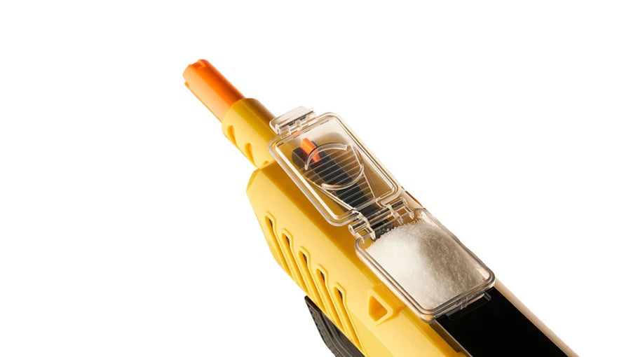 Close-up of a yellow bug gun on a white background