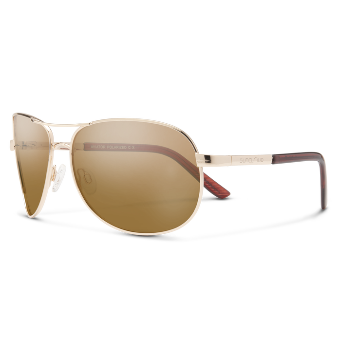 Gold-framed sunglasses with brown lenses on a white background