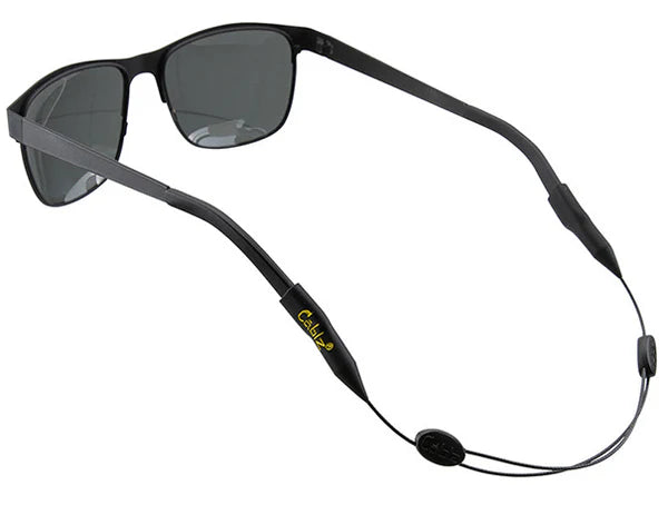 Black sunglasses with a black cord on a white background
