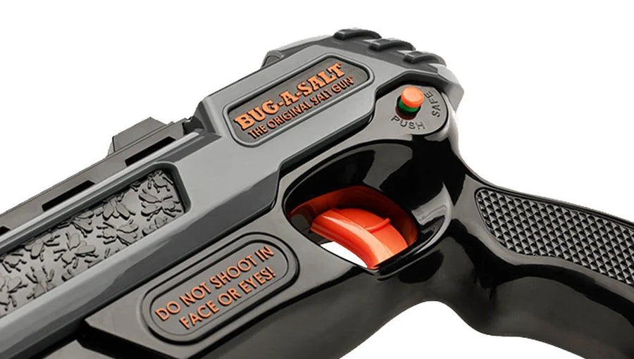 Toy gun with 'Bug-A-Salt' branding and safety warning on a white background