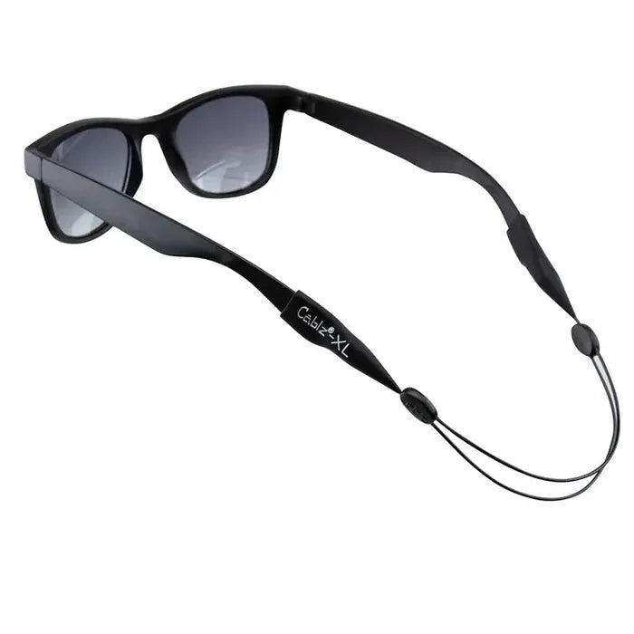 Black sunglasses with a black cord on a white background