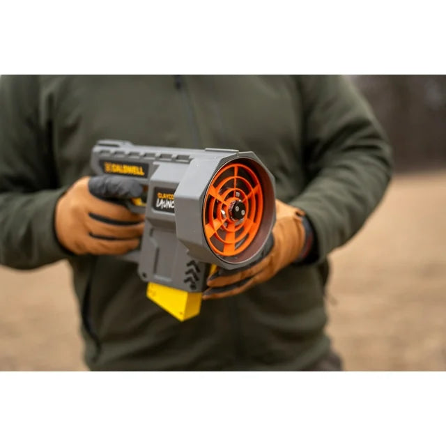 Person holding a target gun with a blurred background
