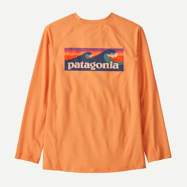 Orange long-sleeve shirt with Patagonia logo on a light gray background