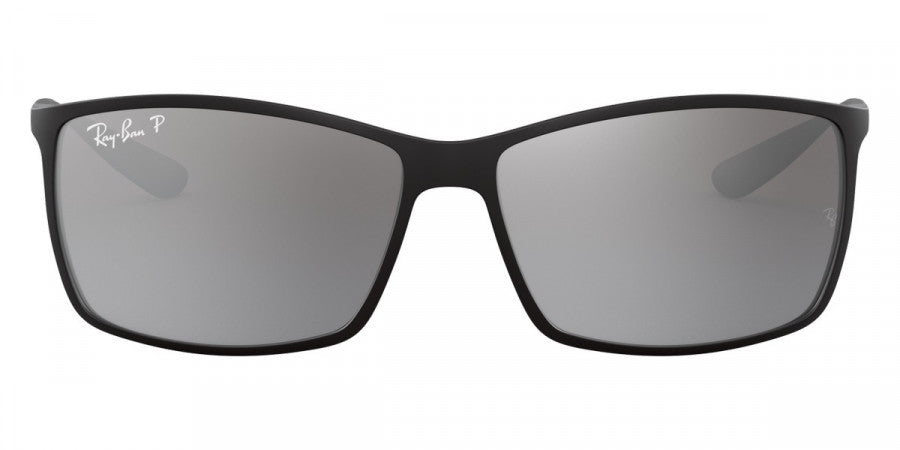 Black sunglasses with gray lenses on a white background