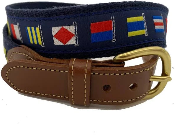 Navy belt with colorful flag pattern and brown leather strap on a white background