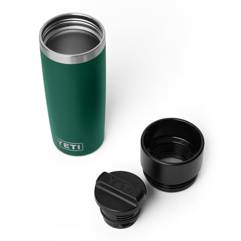 Green YETI insulated mug with two black lids on a white background