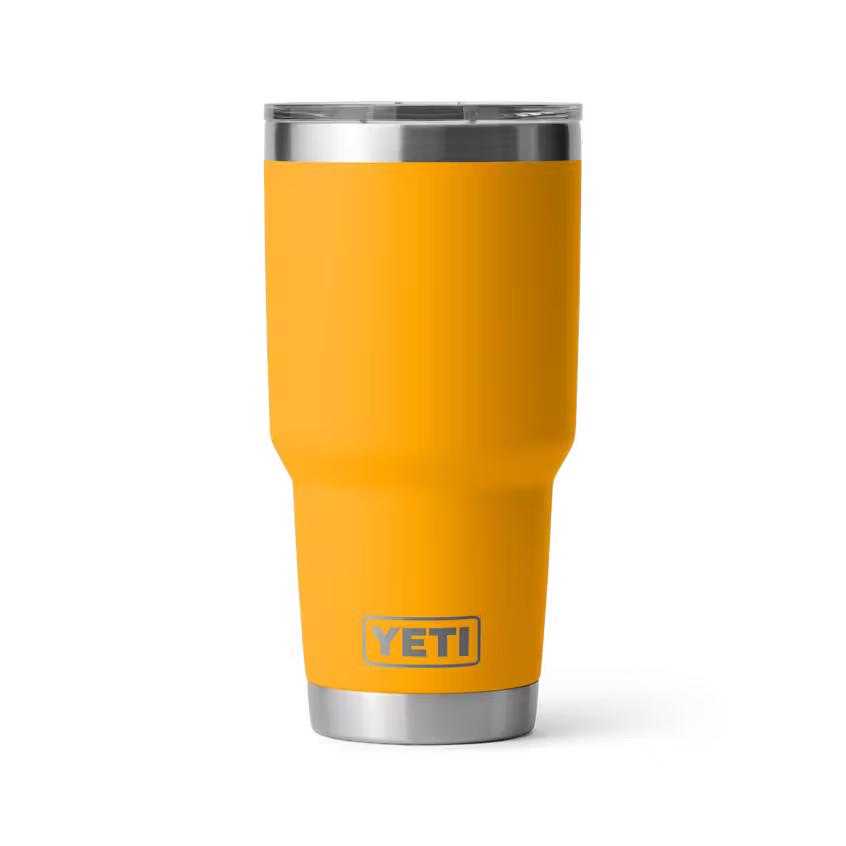 Yellow YETI tumbler on a white background